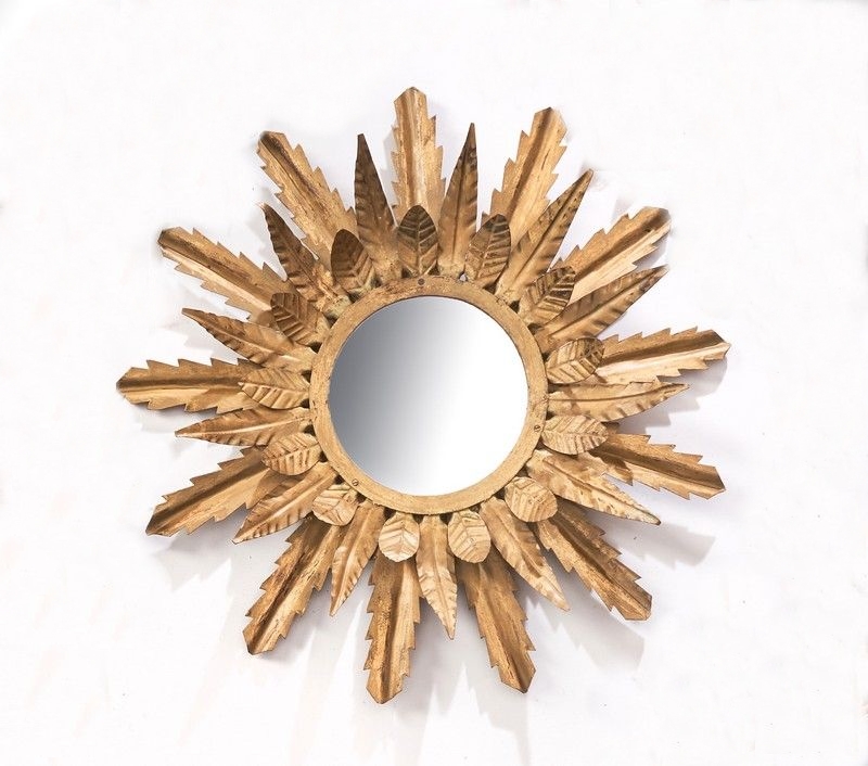 MIROIR SOLEIL rond dans un cadre en métal...