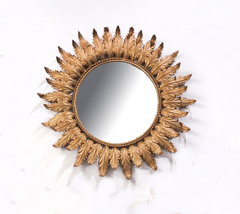 MIROIR SOLEIL rond dans un cadre en métal...
