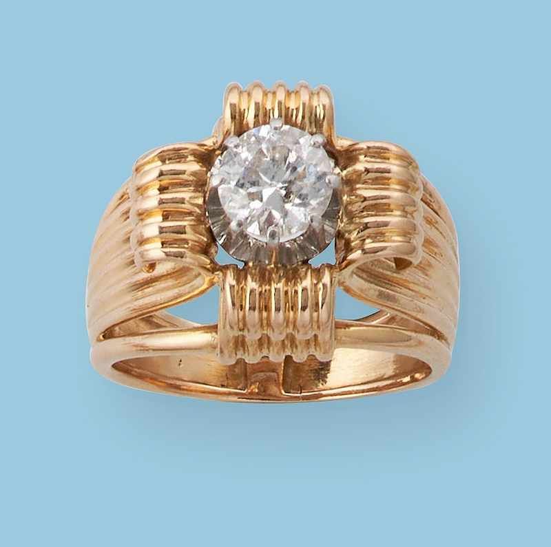 BAGUE en or 750 centrée d'un diamant demi-taille...