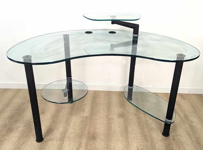 BUREAU à plateau en verre de forme rognon...