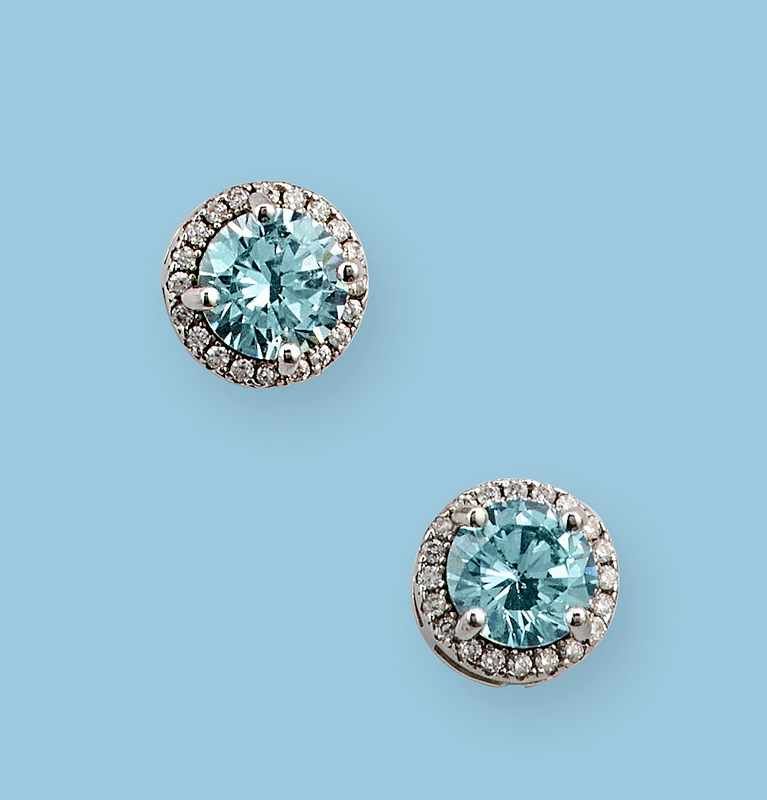 PAIRE DE PUCES D'OREILLES en argent (925)...