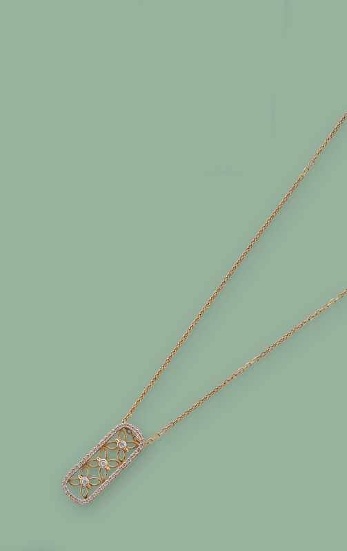 CHAINE en or sertie d'un pendentif filigranné...