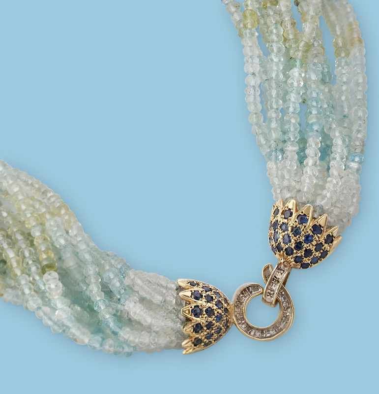 COLLIER de 11 rangs de petites billes d'aigues-marines,...