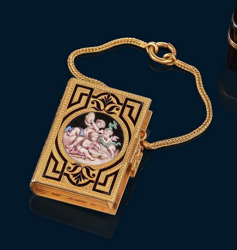 PENDENTIF en forme de livre en or (750) et...