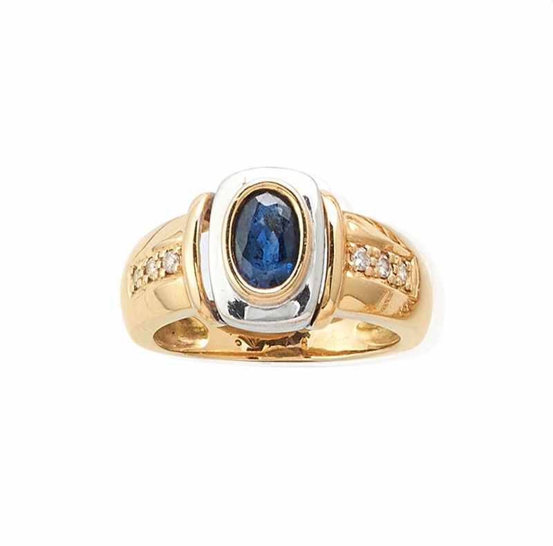 BAGUE en or jaune et gris (750) ornée d'un...