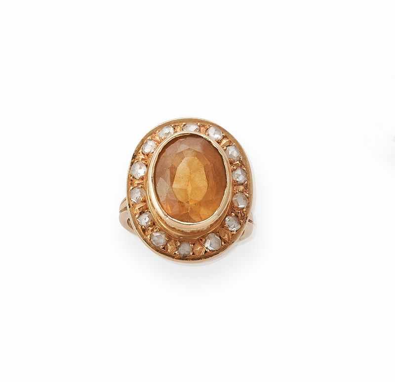 BAGUE en or (750) centrée d'une citrine ovale...