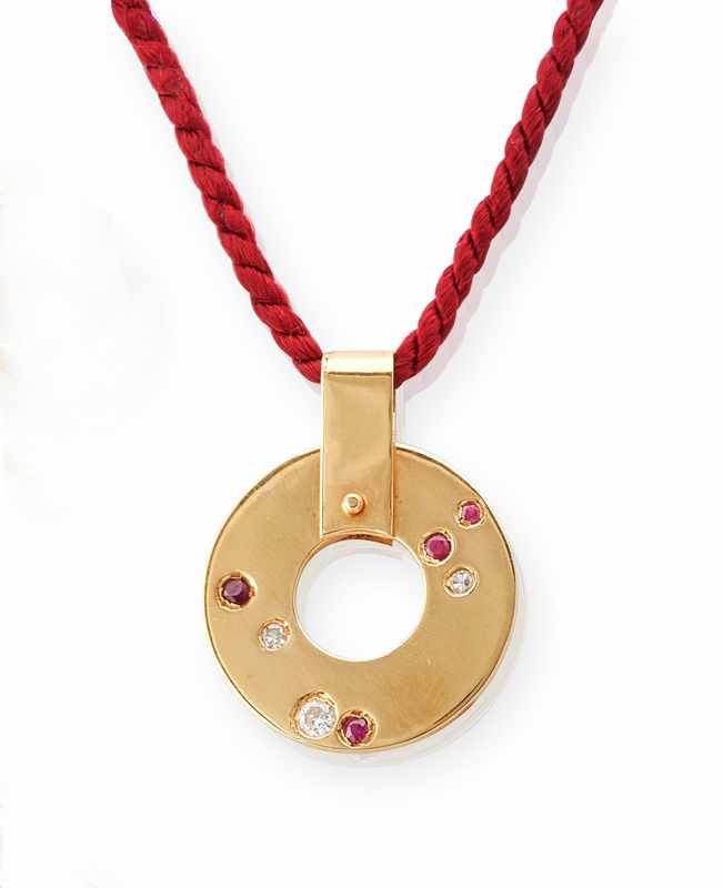 PENDENTIF en or (750) de forme circulaire,...