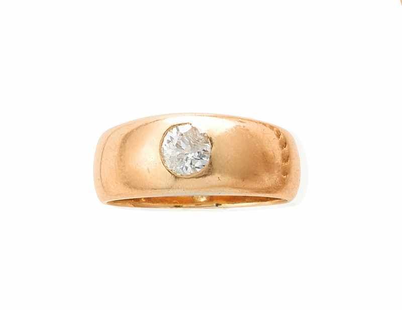 BAGUE jonc en or (750) ornée d'un diamant...