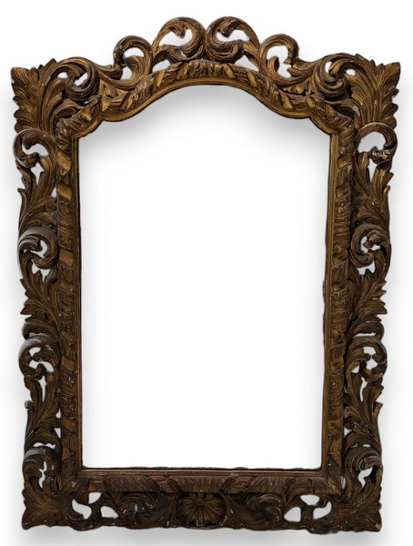 GRAND MIROIR à cadre richement sculpté de...