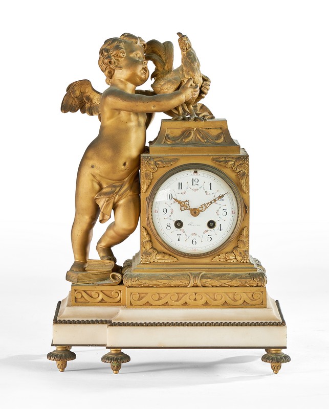 PENDULE borne en bronze doré figurant un...