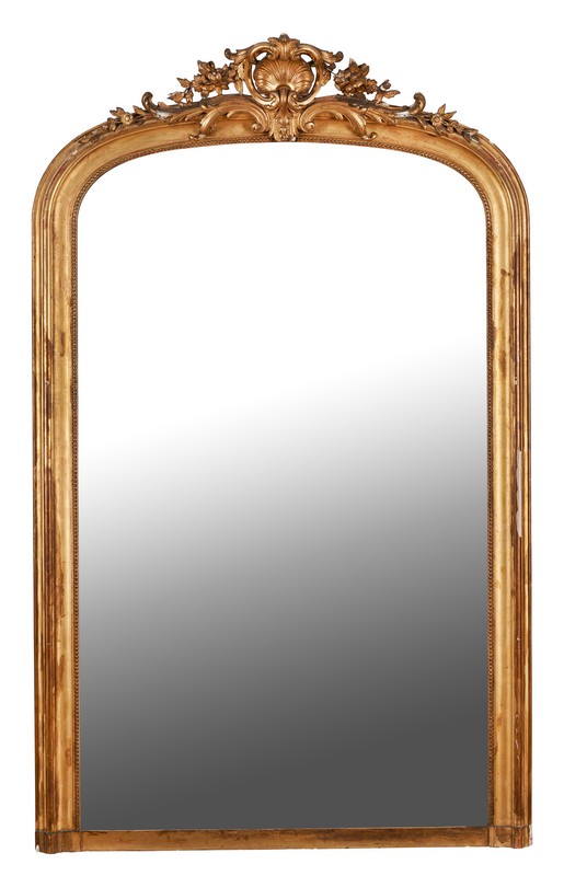 GRAND MIROIR dans un cadre en bois doré à...