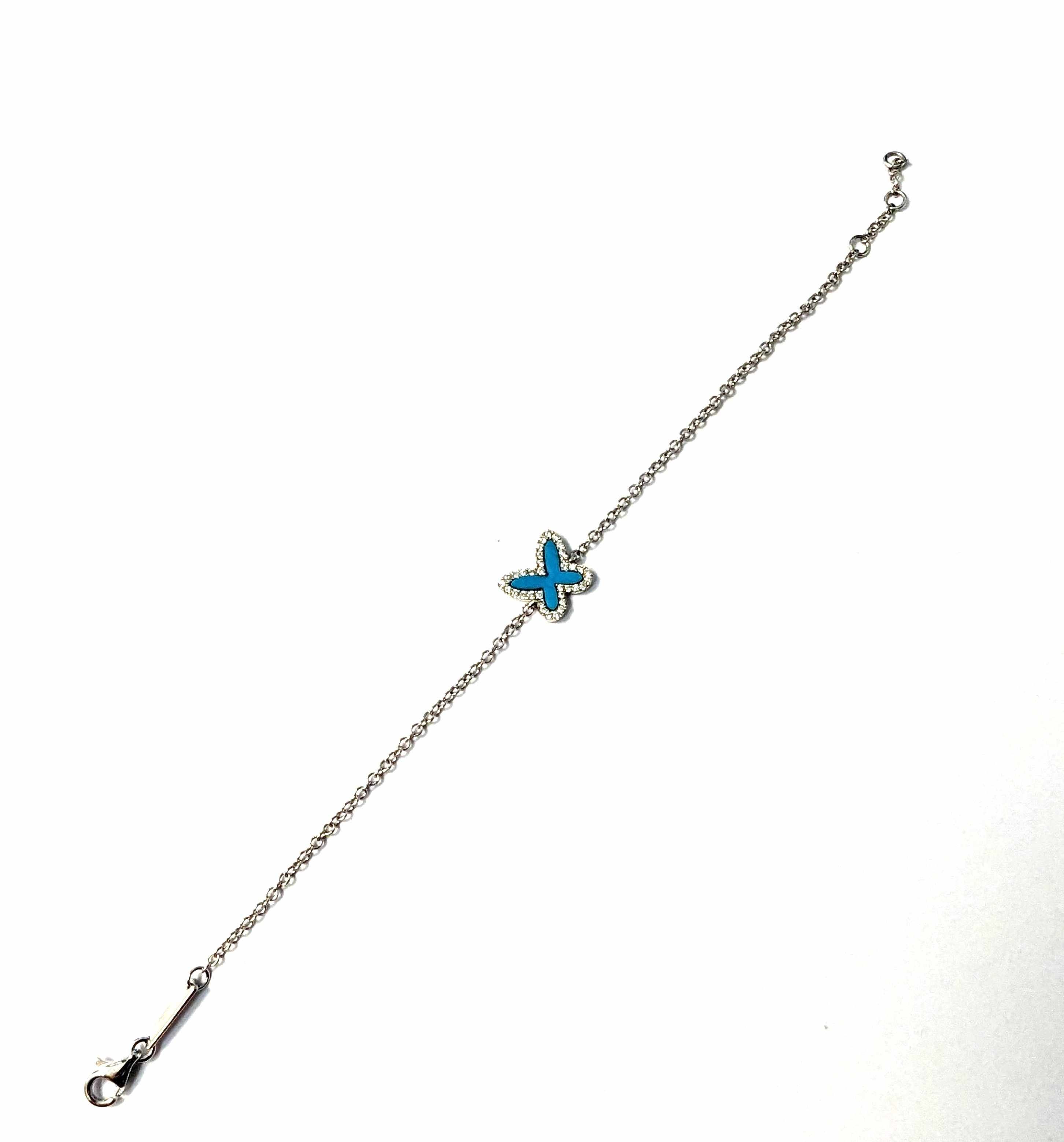 BRACELET en or gris (750) et son motif papillon...