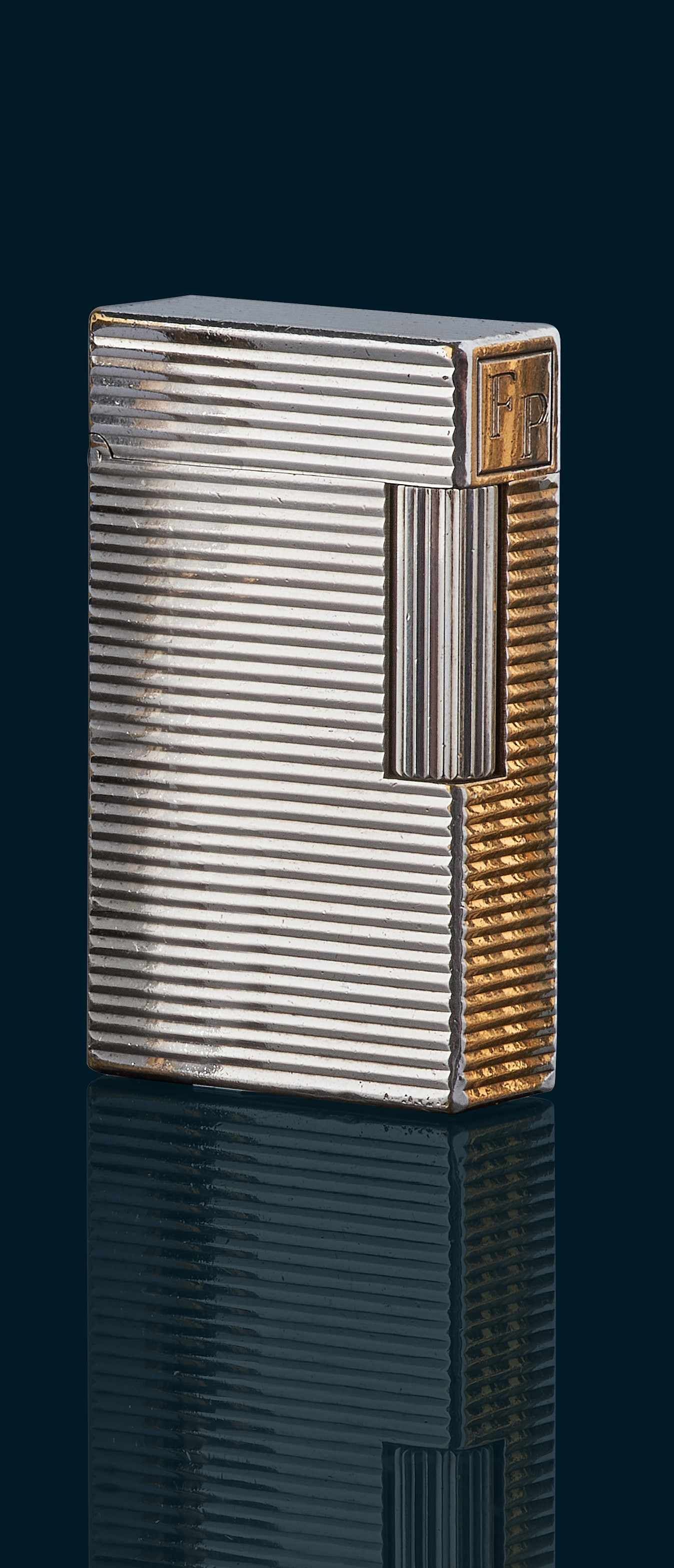 DUNHILL DEUX BRIQUETS, l un en métal doré...