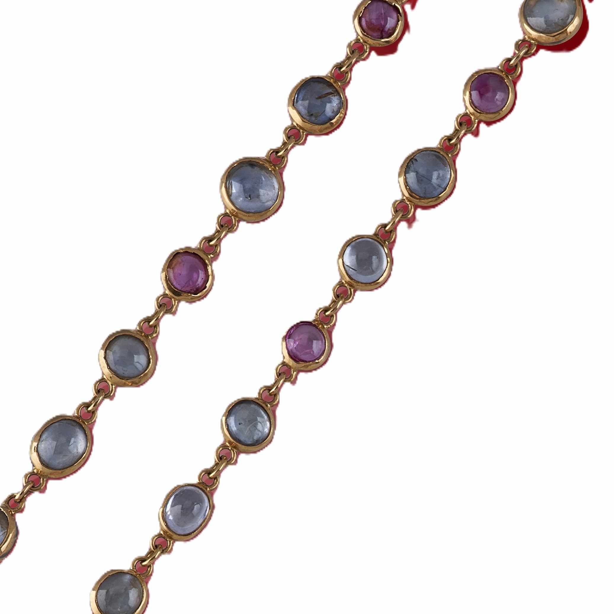 COLLIER en or (750) à cabochons rubis (traités)...
