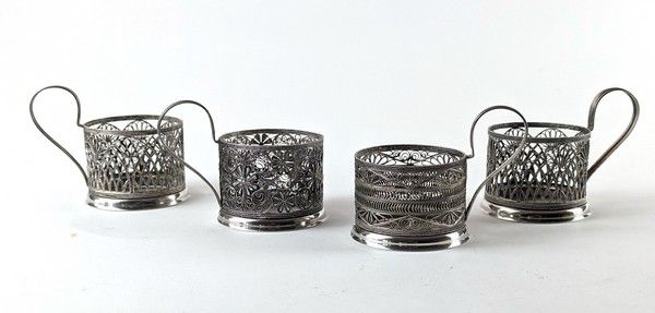 QUATRE MONTURES DE VERRE, en métal argenté...