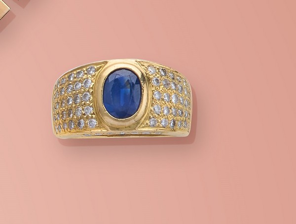 BAGUE jonc en or (750) ornée d'un saphir...