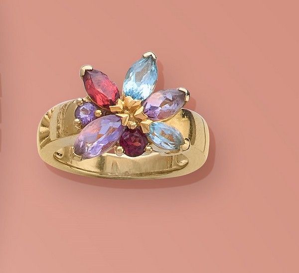 BAGUE en or (750) à motif de fleur en pierres...