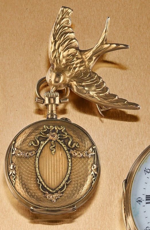 MONTRE DE COL ET SA BROCHE en forme d'hirondelle,...