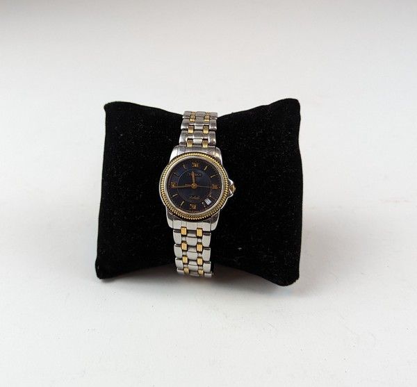 TISSOT MONTRE DE DAME acier et acier doré....
