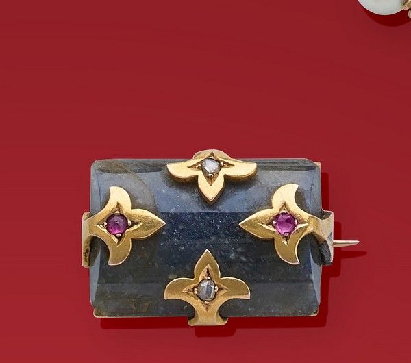 BROCHE rectangulaire en or (750) sertissant...