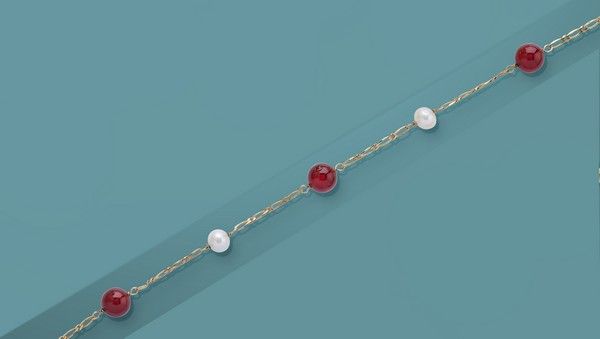 BRACELET en or (750) avec deux perles d'eau...