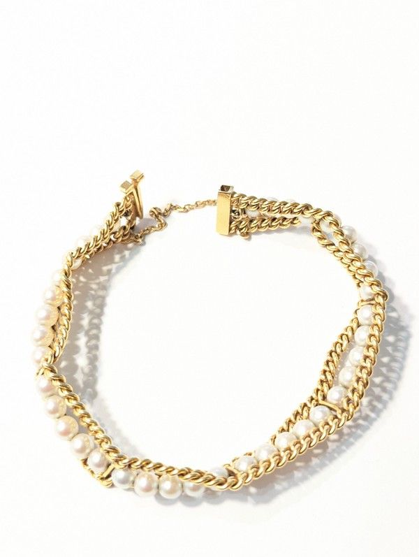 BRACELET en or jaune (750) à double rang...