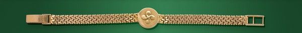 BRACELET en or (750) avec médaillon en croix...