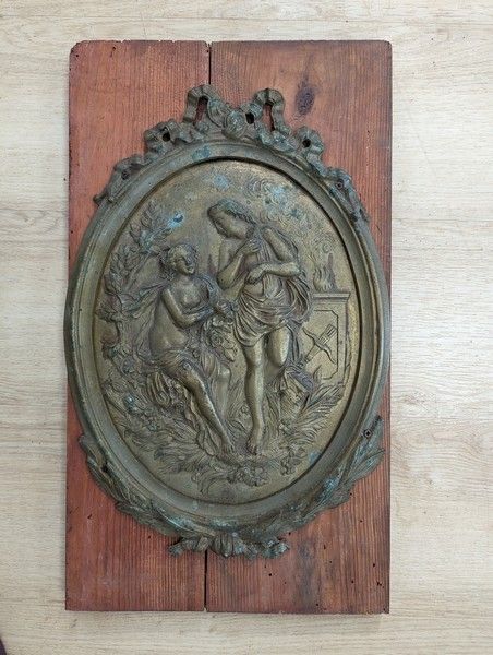 MEDAILLON en bronze et laiton représentant...