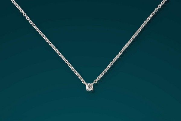 CHAÎNE ET PENDENTIF DIAMANT (environ 0,15...