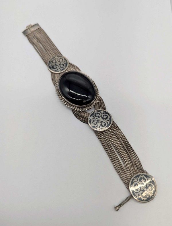 BRACELET souple en argent (900) serti d'une...
