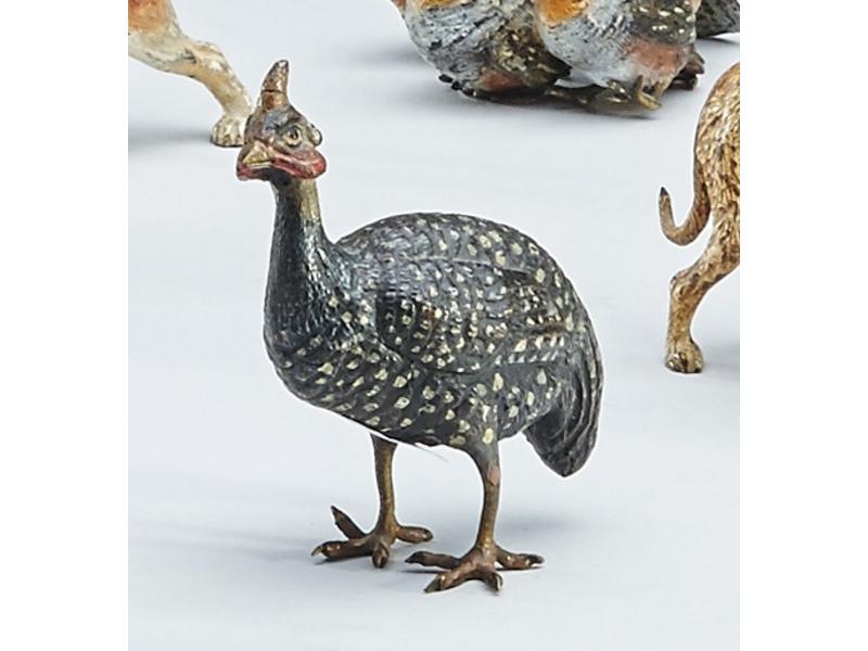 PINTADE en bronze polychrome.