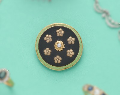BROCHE-PENDENTIF ronde en or (750) à plaque...