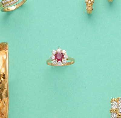 BAGUE marguerite en or (750) ornée d'un rubis...