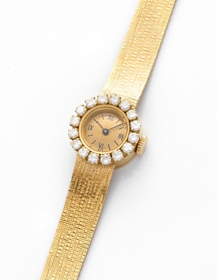 MONTRE bracelet de dame en or (750) à petit...