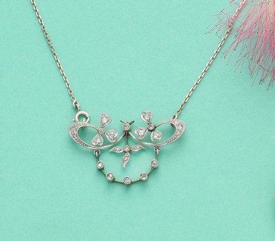 PENDENTIF squelette en or (750) et argent...