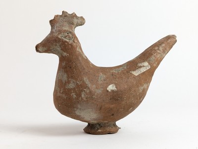 STATUETTE en terre cuite figurant un volatile,...