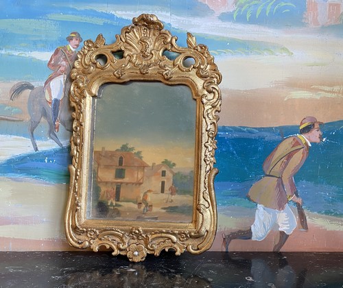 DEUX MIROIRS cintrés dans des cadres en bois...