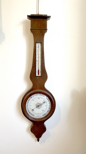 BAROMETRE-THERMOMETRE dans un cadre en acajou...