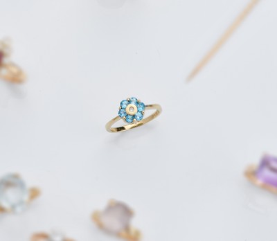 BAGUE fleurs en or jaune (585) avec topazes...