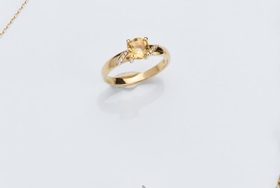 BAGUE en or (750) ornée d'une citrine ronde,...