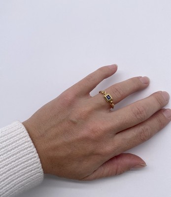 BAGUE SOUPLE en or (750) centrée d'un saphir...