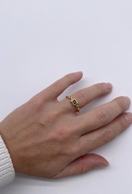 BAGUE SOUPLE en or (750) centrée d'un saphir...