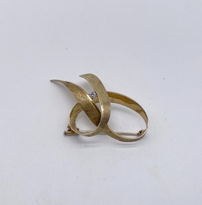 BROCHE en or (585) en forme de noeud, avec...