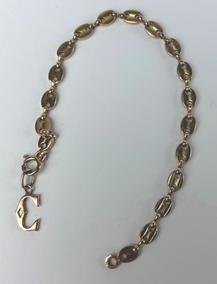 BRACELET souple en métal doré à mailles grains...