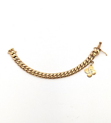 GOURMETTE en or (750) et sa breloque "croix...