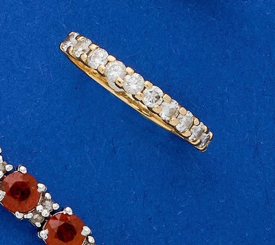 DEMI ANNEAU en or (750 ) et onze diamants...