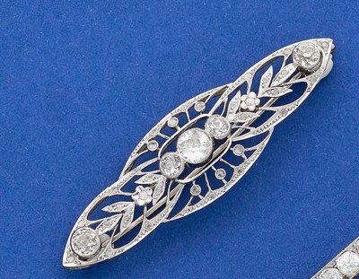 BROCHE en deux tons d'or (750) sertie de...