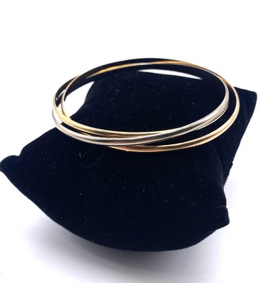 BRACELET dit « trinité » en trois tons d’or...
