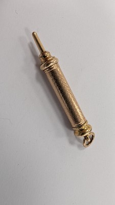 PORTE-MINE en métal plaqué or à fût rétractable....