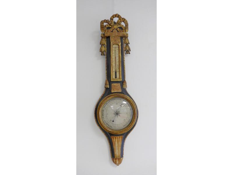 BAROMETRE-THERMOMETRE en bois sculpté doré...